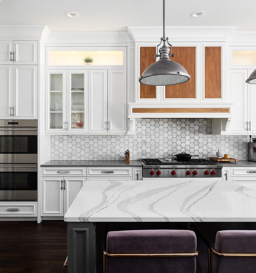 Stylish kitchen featuring hexagonal tile backsplash